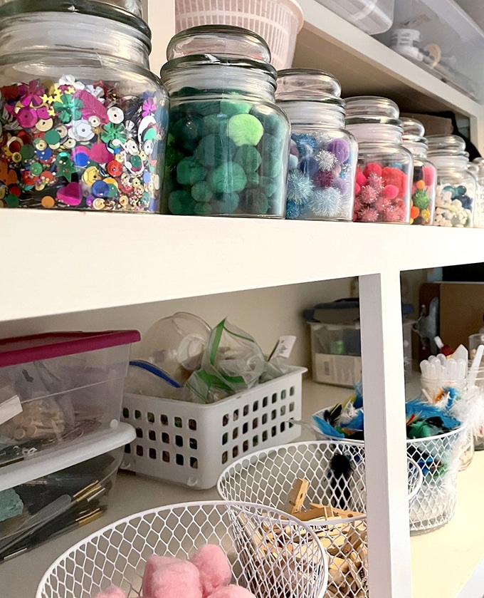 Sorted art supplies in containers for home art space