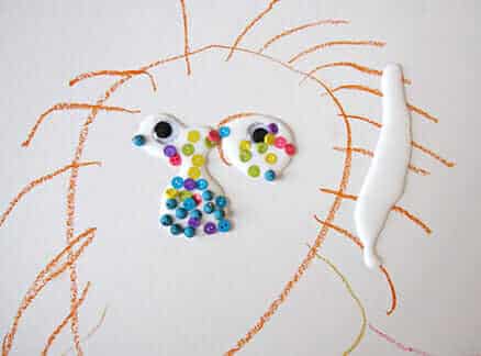 How to Make Mixed Media Collage Art With Your Kids - face with beads & google eyes