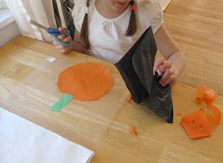 Pumpkin Suncatcher - cut tissue paper shapes