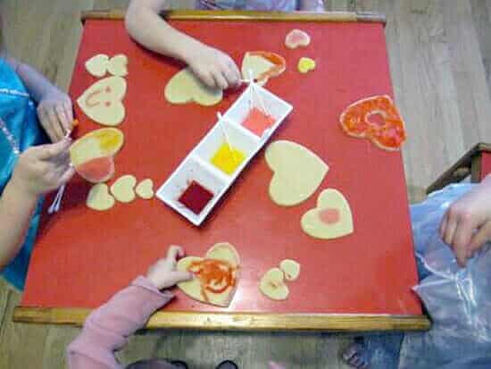 Painting heart cookies for Valentine's Day