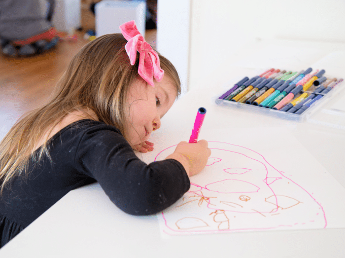 little girl drawing with markers arts and crafts activities