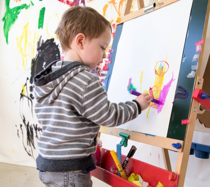 boy drawing at easel