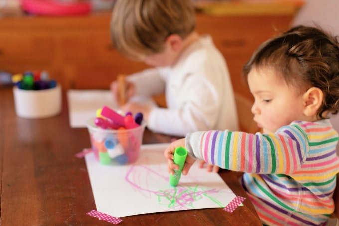 children drawing with tempera sticks