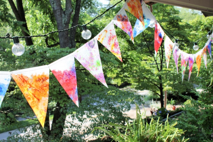 summer art activities crayon stained glass bunting in backyard