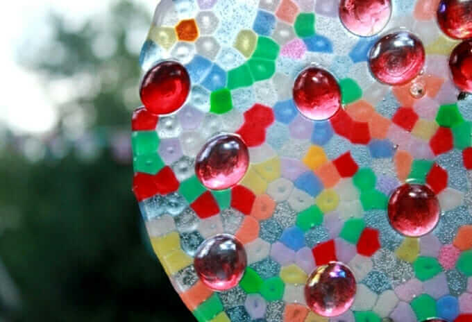 melted pony bead suncatcher with glass stones embedded