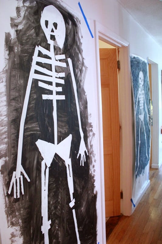Tape Resist Skeleton Paintings – hanging on wall