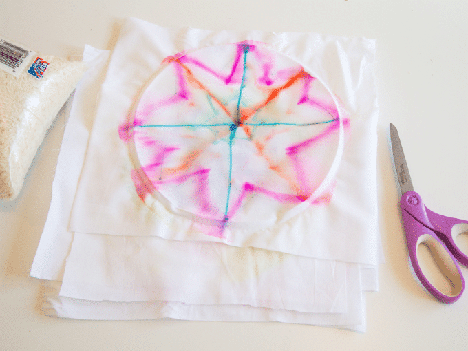 cutting out fabric tie dye star