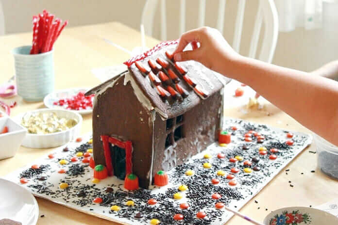 How to Make A Halloween Gingerbread House – Decorating roof with candy