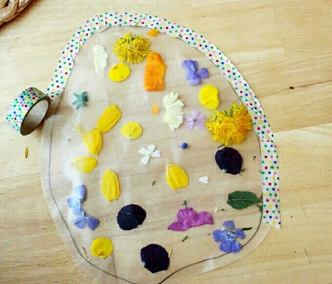 Adding washi tape to an Easter egg suncatcher craft
