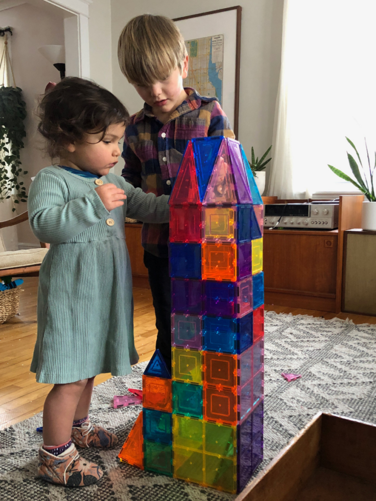 kids building with magnetic tiles