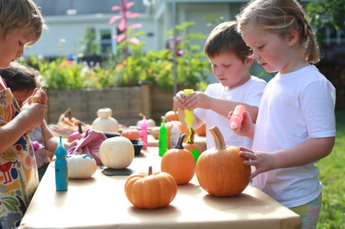 children painting pumpkins _ rachel withers