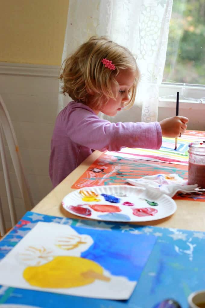 Painting side by side with children