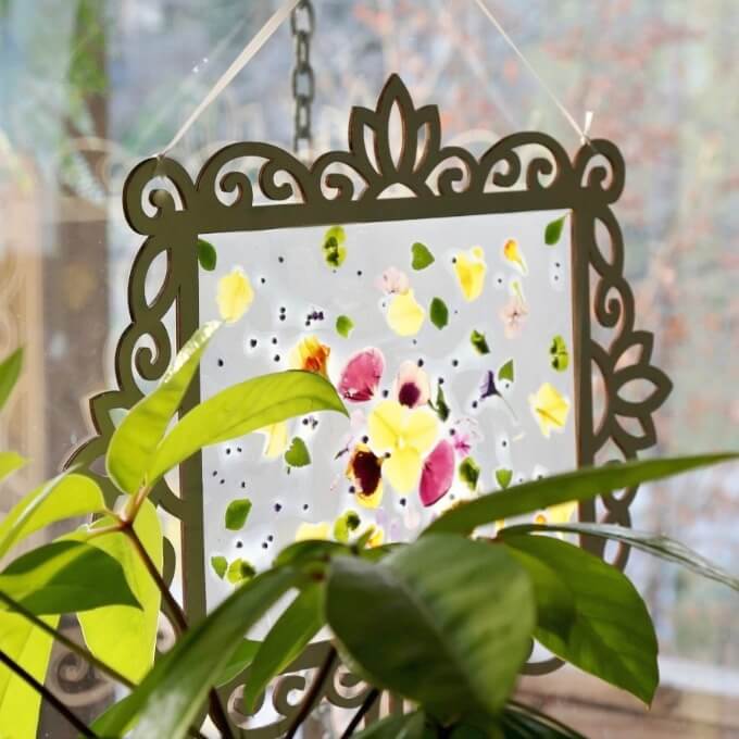 A Flower Petal Contact Paper Suncatcher Hanging in the Window