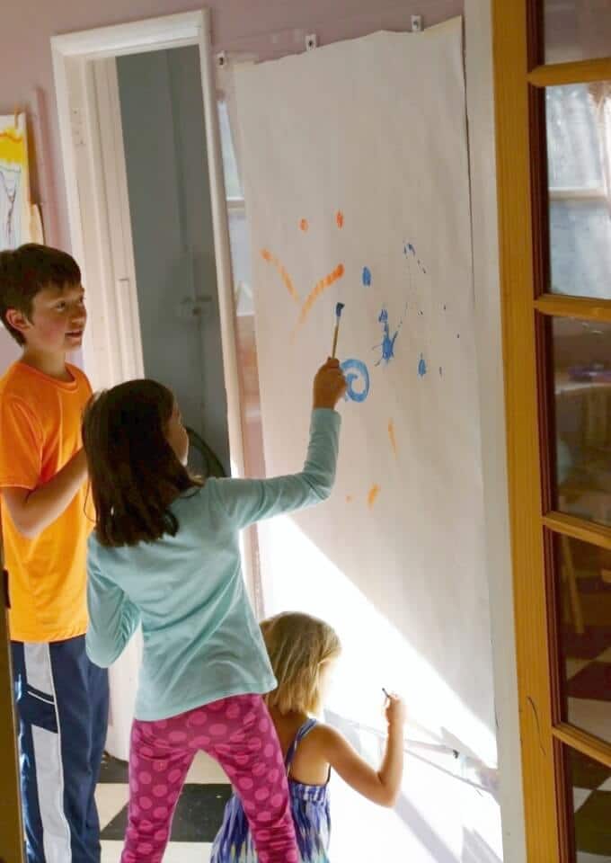 Kids Splatter Painting on a DIY Wall Mount Easel