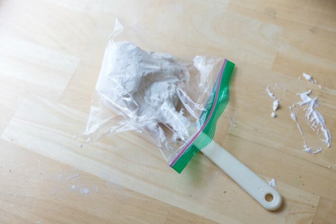 Putting homemade puffy paint in a ziploc sandwich bag