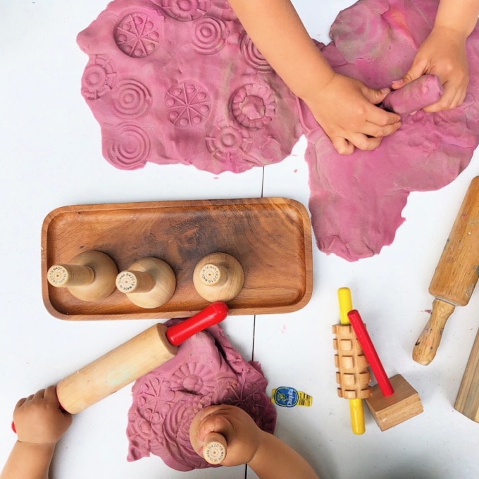 using stamps on playdough