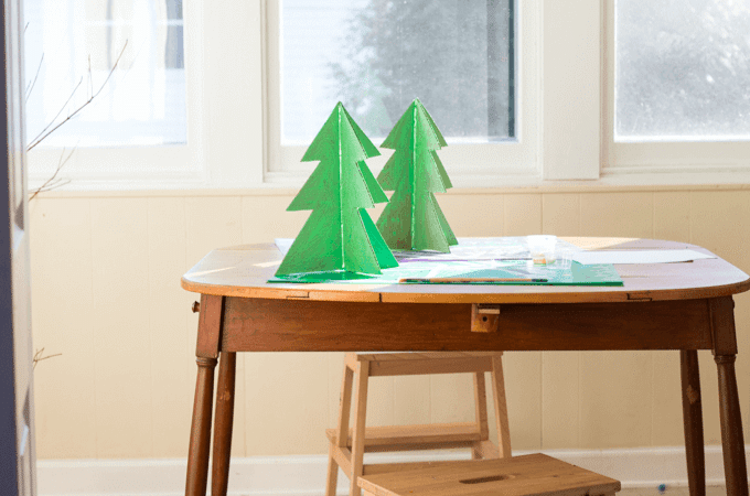 Cardboard Christmas trees on work table