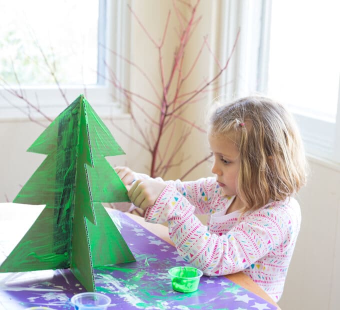Painting the cardboard Christmas tree