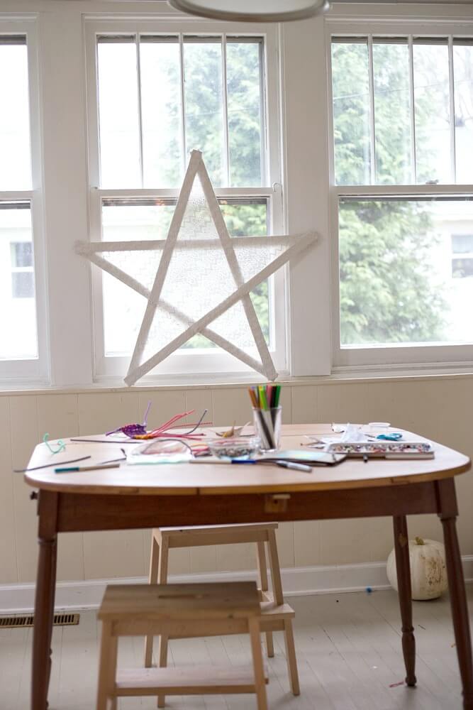 Lace covered wooden star in the window