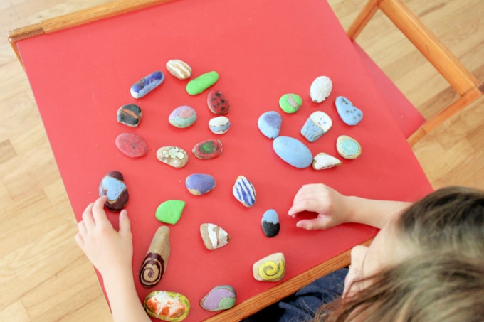 arranging painted rocks