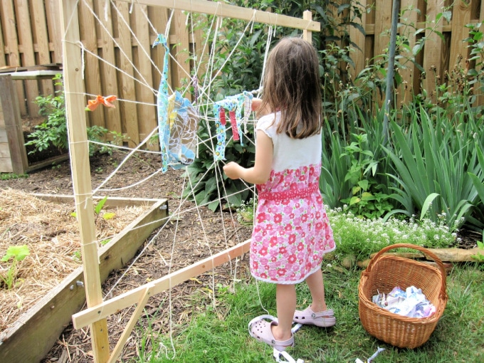 Child creating a garden loom