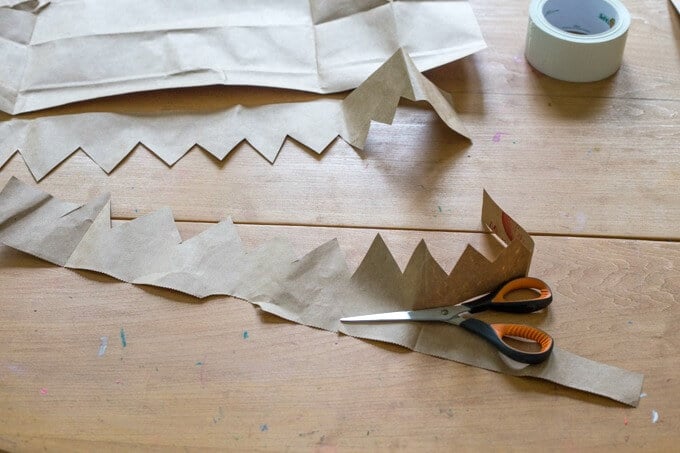 How to cut a paper grocery bag to make our own play crowns.