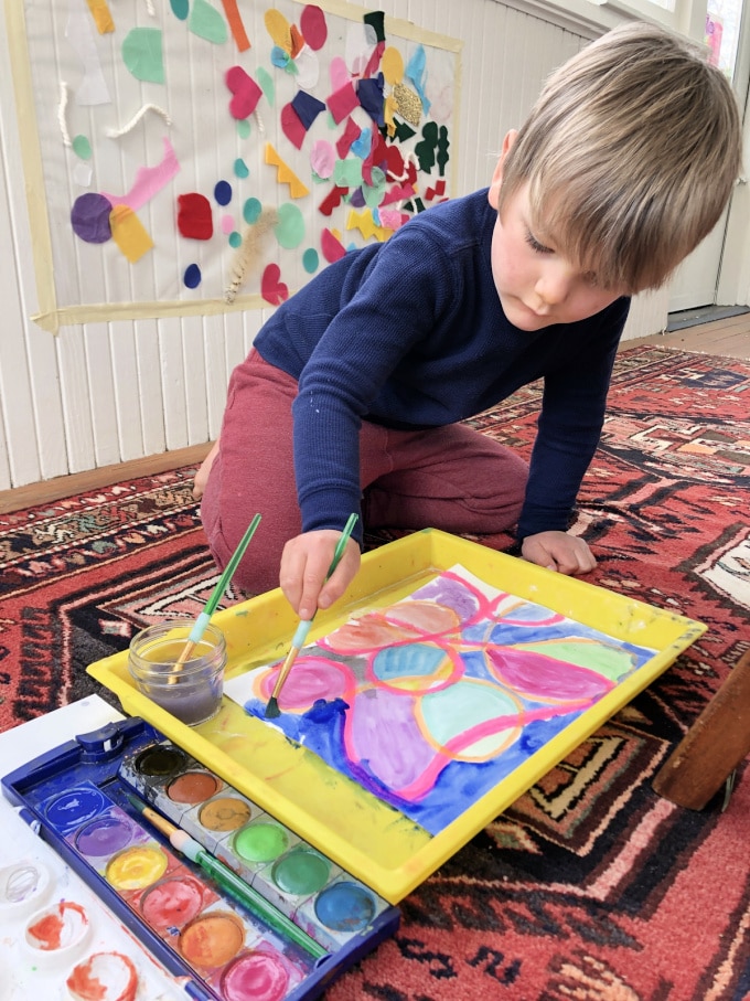 child painting on floor