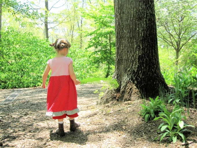 child walking in the woods
