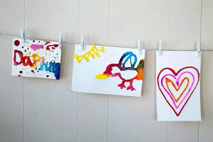 Raised Salt Paintings Hanging on Display Wire