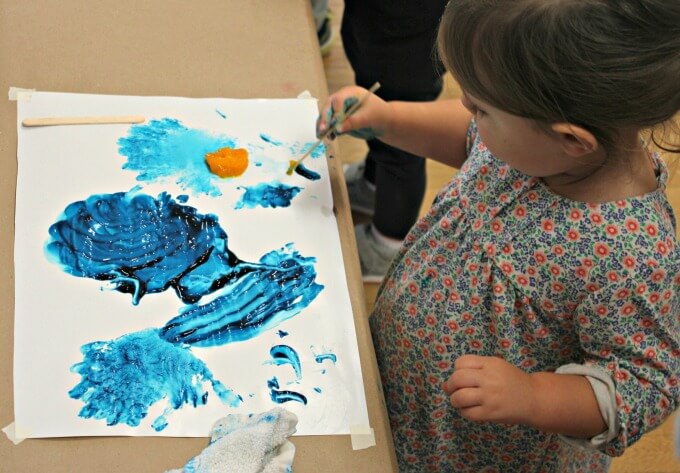 Ella Kate popsicle stick painting in Toddler Art Class