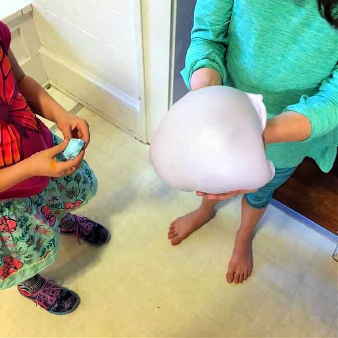 children making bubble with slime 