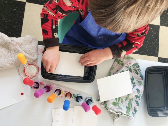 Child making marbled paper