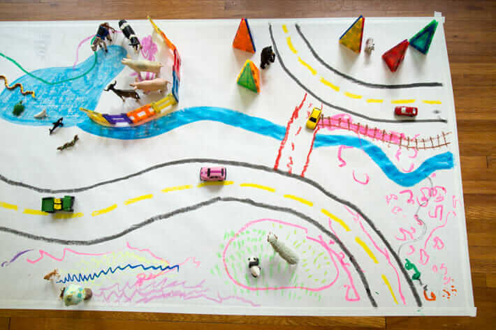 How to make your own play mat for kids with paper and paint sticks