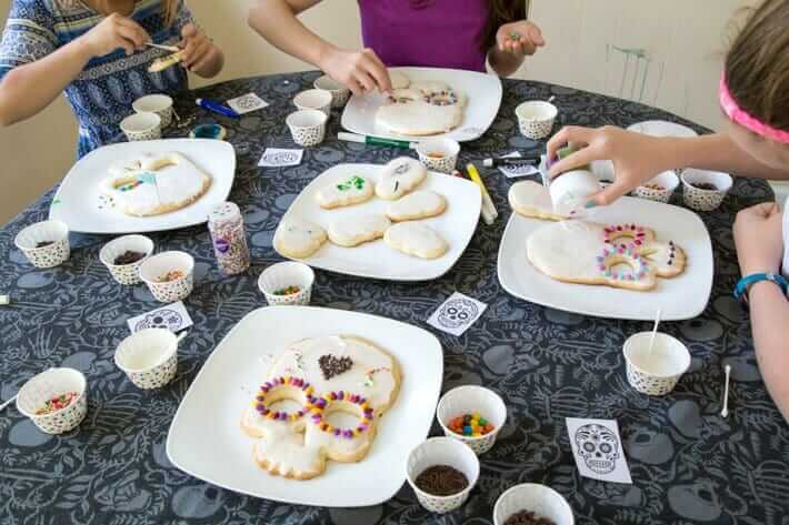 Decorating sugar skull cookies with kids
