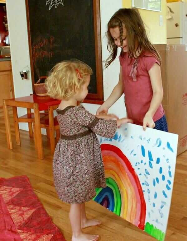 Maia Giving Daphne a Rainbow Painting for Her Birthday