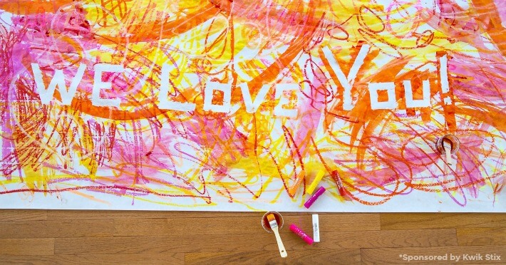 Tape Resist Art with Kwik Stix - A Banner That Says "We Love You!"