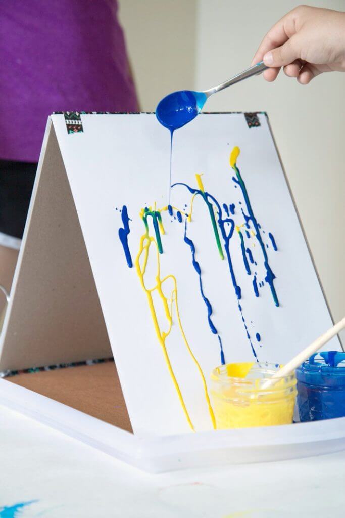 Drip Painting Blue and Yellow Paint on a DIY Cardboard Easel