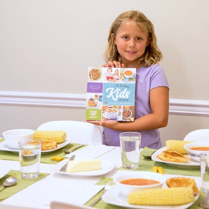 Daphne Holding The Ultimate Kids Cookbook