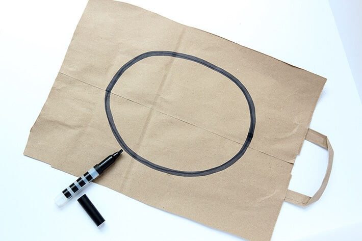 Draw oval shape on paper bag