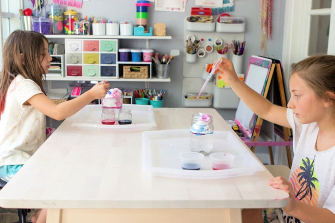  Megan Schiller - Two girls using liquid watercolors and shaving cream to create a rain cloud