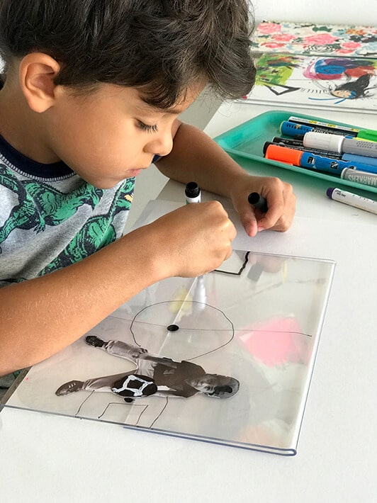Boy drawing self portrait for mixed media artwork