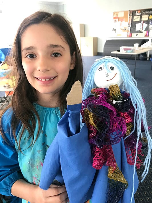 Girl with hand puppet