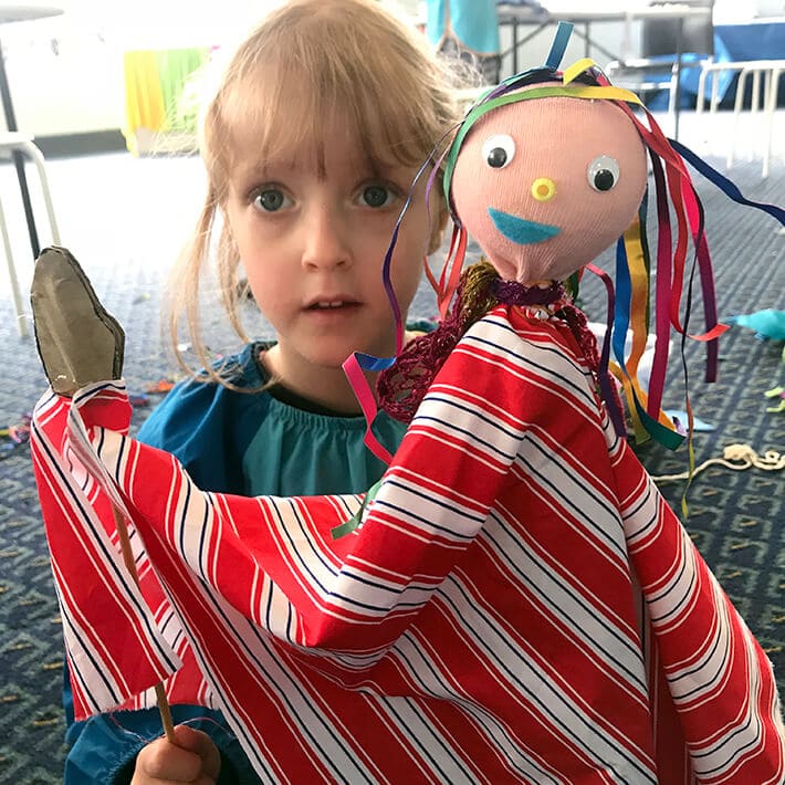 Girl with stick puppet