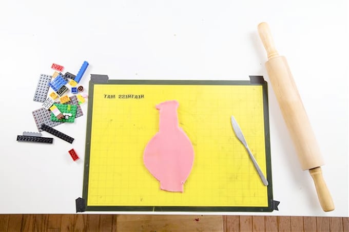 Cut-out-playdough-shapes-for-LEGO-prints-using-rolling-pin-LEGOs-playdough-butter-knife