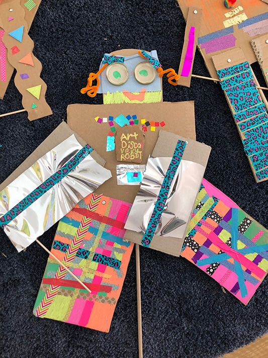 Cardboard robot puppets for kids made with recycled materials