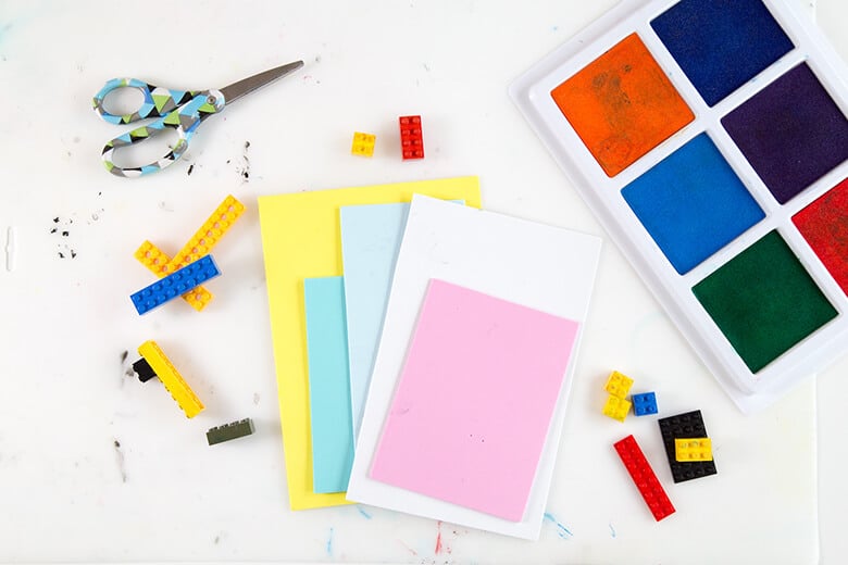 Stamp pads, LEGOs & paper for creating LEGO prints