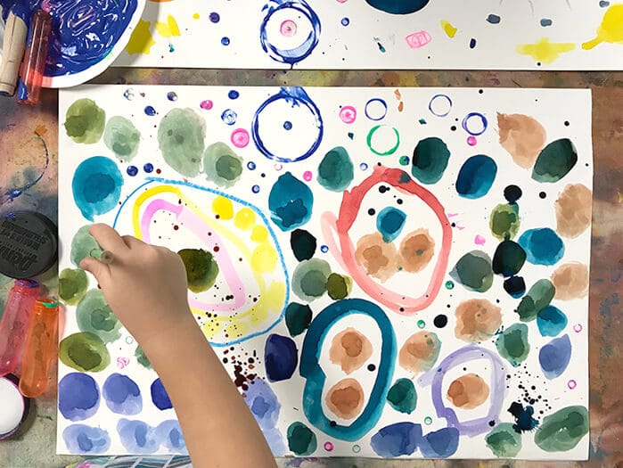 Child painting Yayoi Kusama Inspired Dot Paintings for Kids