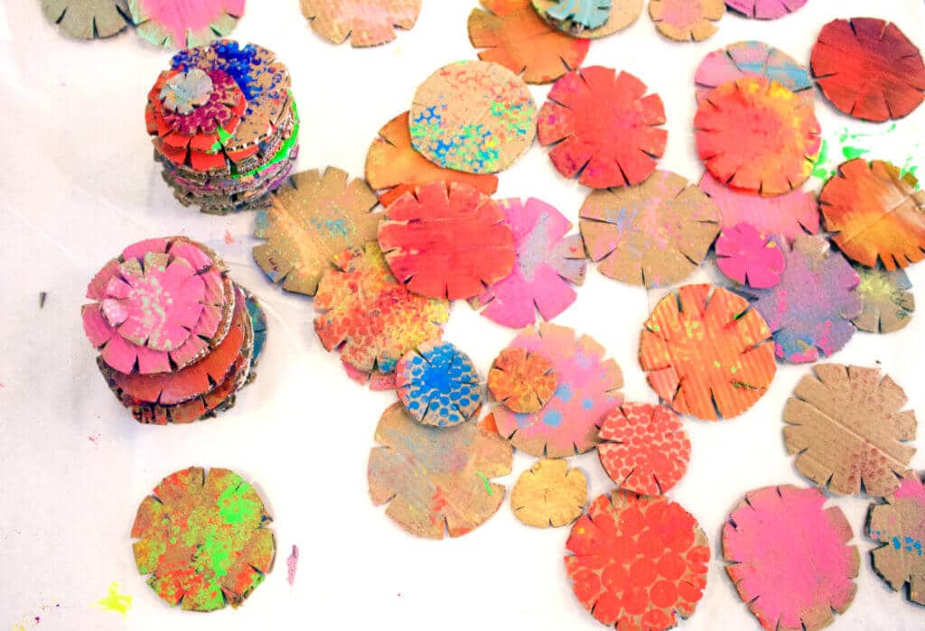 Colorful painted cardboard building discs for kids