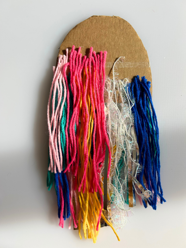 taping yarn to cardboard
