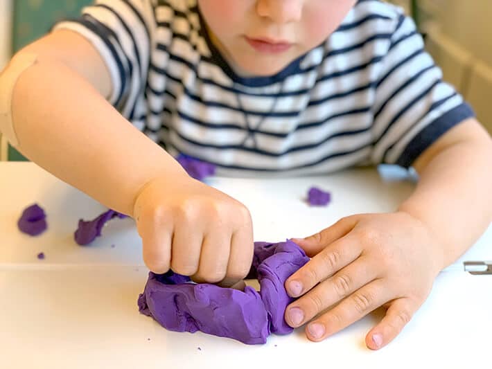 Traveling with toddlers – boy with playdough